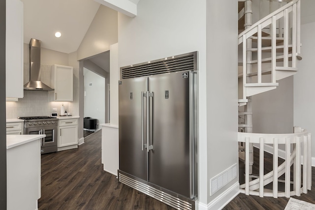 7 Loblolly Ct, Lemont, IL 60439 - kitchen with high end appliances, wall chimney exhaust hood, white cabinetry, light countertops, and dark wood-style flooring