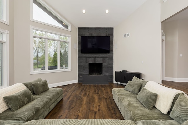 7 Loblolly Ct, Lemont, IL 60439 - living room with wood finished floors, lofted ceiling, a brick fireplace, and recessed lighting