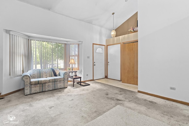 3411 Harris Dr, Joliet, IL 60431 - carpeted living room with high vaulted ceiling and baseboards