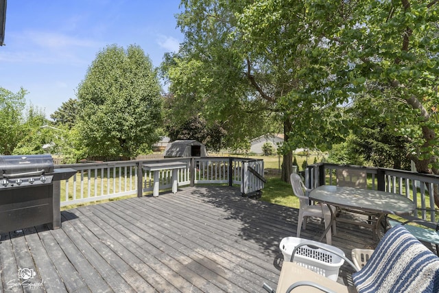 3411 Harris Dr, Joliet, IL 60431 - deck featuring a shed, grilling area, and outdoor dining space