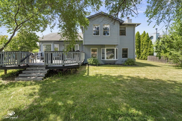 3411 Harris Dr, Joliet, IL 60431 - back of property with a chimney and a deck