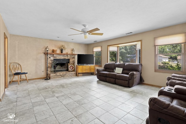 3411 Harris Dr, Joliet, IL 60431 - living area with ceiling fan, a fireplace, and light tile patterned floors