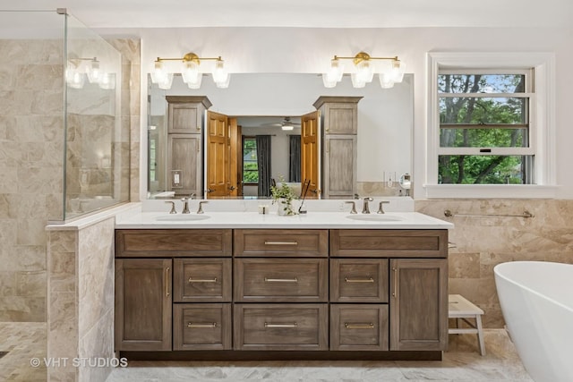 1909 Bridle Ct, Saint Charles, IL 60174 - bathroom with a soaking tub, double vanity, a walk in shower, plenty of natural light, and tile walls