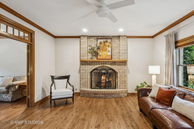 1909 Bridle Ct, Saint Charles, IL 60174 - living area with ornamental molding, a fireplace, wood finished floors, a ceiling fan, and recessed lighting