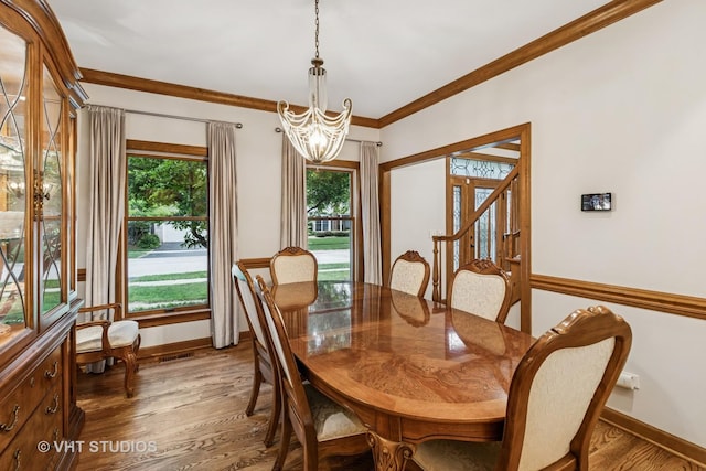 1909 Bridle Ct, Saint Charles, IL 60174 - dining room featuring a chandelier, wood finished floors, and crown molding