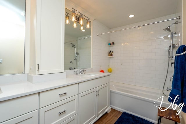 34119 N Hainesville Rd, Round Lake, IL 60073 - full bath with vanity, tub / shower combination, wood finished floors, and recessed lighting