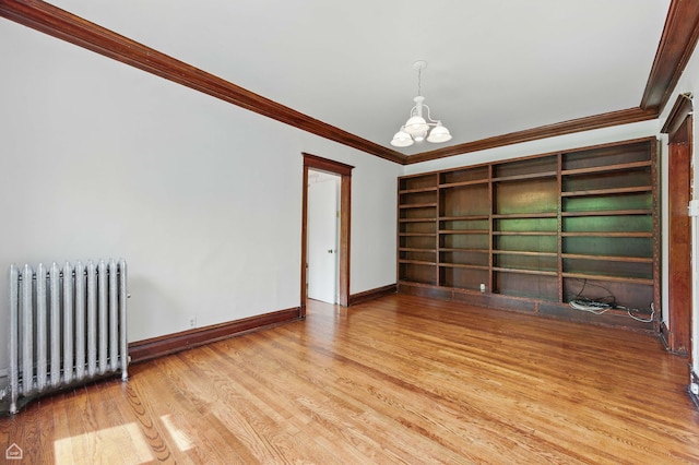 1235 E 53rd St Unit 3, Chicago, IL 60615 - empty room with radiator, crown molding, a chandelier, and wood finished floors