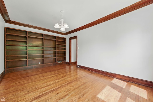 1235 E 53rd St Unit 3, Chicago, IL 60615 - empty room featuring crown molding, a chandelier, and wood finished floors