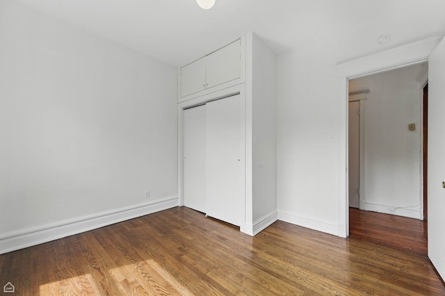 1235 E 53rd St Unit 3, Chicago, IL 60615 - unfurnished bedroom with wood finished floors and a closet