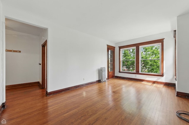 1235 E 53rd St Unit 3, Chicago, IL 60615 - unfurnished room with radiator heating unit and hardwood / wood-style floors