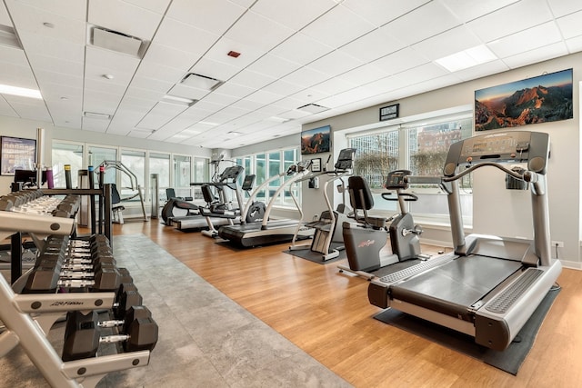 57 E Delaware Pl Unit 2901, Chicago, IL 60611 - exercise room featuring a paneled ceiling and wood finished floors