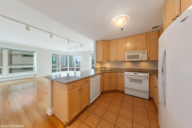 57 E Delaware Pl Unit 2901, Chicago, IL 60611 - kitchen with white appliances, light brown cabinets, a peninsula, and open floor plan