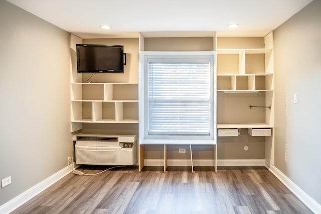 535 E Jefferson St Unit 2C, Bensenville, IL 60106 - unfurnished bedroom with wood finished floors and a wall unit AC