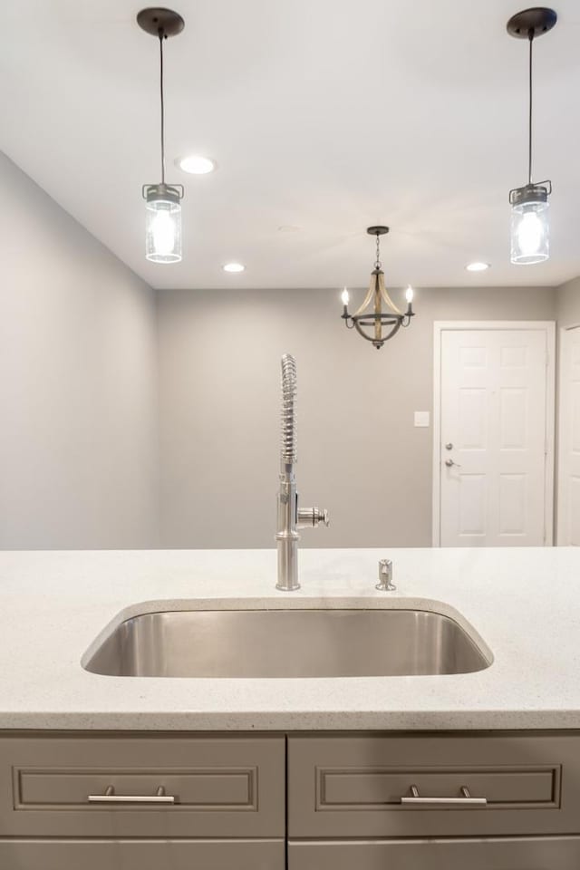 535 E Jefferson St Unit 2C, Bensenville, IL 60106 - kitchen with gray cabinets, recessed lighting, light stone countertops, and decorative light fixtures