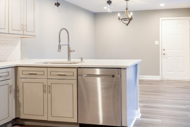 535 E Jefferson St Unit 2C, Bensenville, IL 60106 - kitchen featuring stainless steel dishwasher, a peninsula, light countertops, light wood-style flooring, and recessed lighting