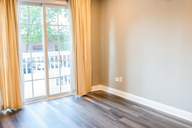535 E Jefferson St Unit 2C, Bensenville, IL 60106 - unfurnished room with dark wood finished floors and baseboards