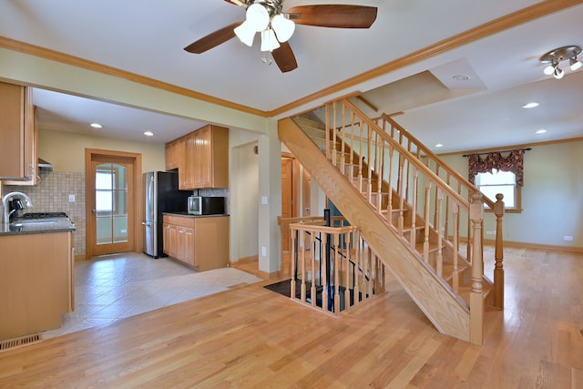 7931 W Metropole St, Elmwood Park, IL 60707 - kitchen with freestanding refrigerator, tasteful backsplash, plenty of natural light, recessed lighting, and crown molding
