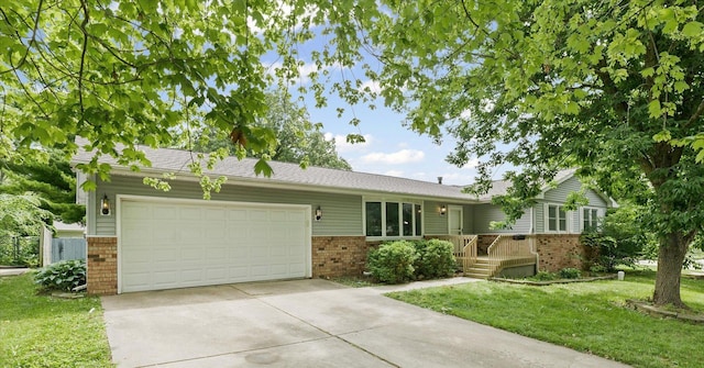 302 S Orr Dr, Normal, IL 61761 - single story home with brick siding, an attached garage, driveway, and a front yard