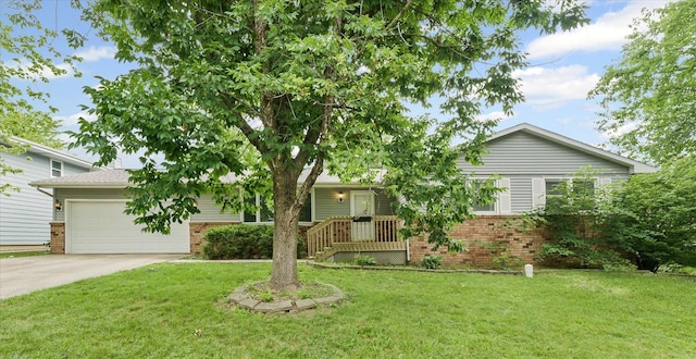 302 S Orr Dr, Normal, IL 61761 - view of front facade featuring brick siding, driveway, and a front yard