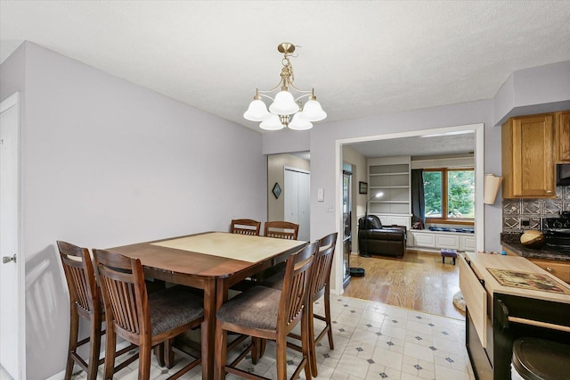 302 S Orr Dr, Normal, IL 61761 - dining room featuring a chandelier