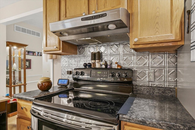 302 S Orr Dr, Normal, IL 61761 - kitchen with electric range, ventilation hood, tasteful backsplash, and dark countertops