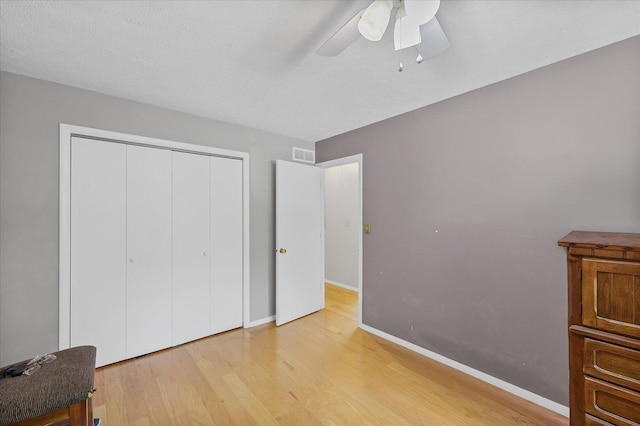 302 S Orr Dr, Normal, IL 61761 - unfurnished bedroom with wood finished floors, a closet, and ceiling fan