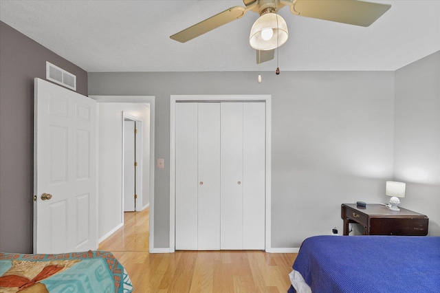 302 S Orr Dr, Normal, IL 61761 - bedroom featuring light wood-style flooring, a closet, and ceiling fan