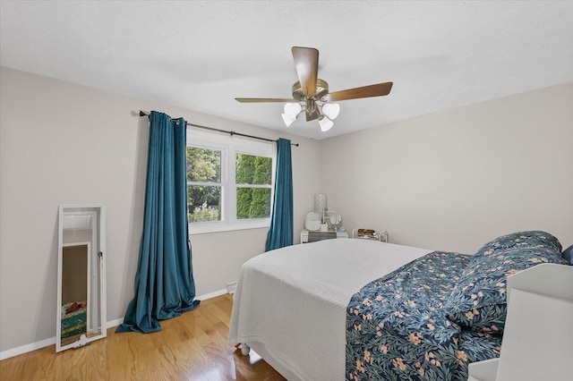 302 S Orr Dr, Normal, IL 61761 - bedroom with light wood-style flooring and a ceiling fan
