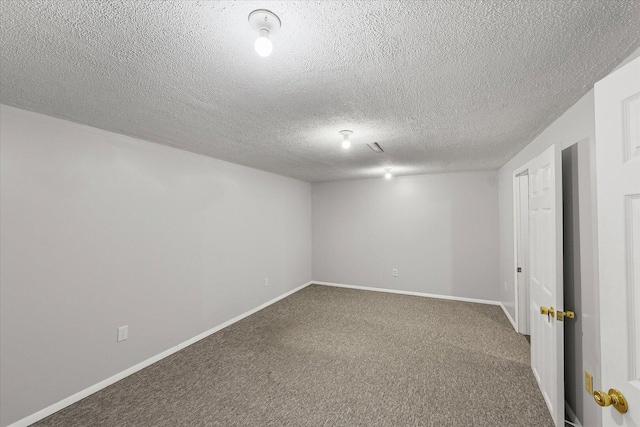 302 S Orr Dr, Normal, IL 61761 - below grade area featuring carpet flooring and a textured ceiling