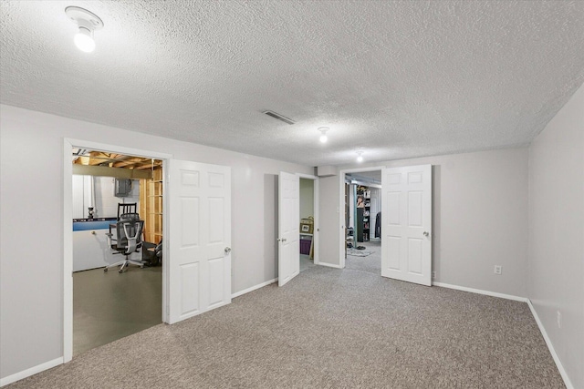 302 S Orr Dr, Normal, IL 61761 - finished below grade area featuring carpet flooring, an office area, and a textured ceiling
