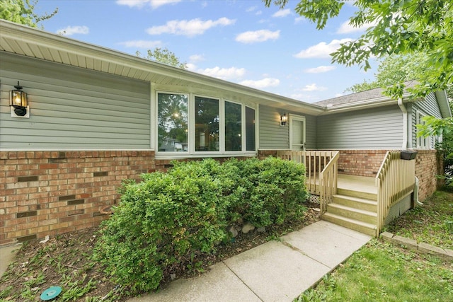 302 S Orr Dr, Normal, IL 61761 - view of home's exterior featuring brick siding and a deck