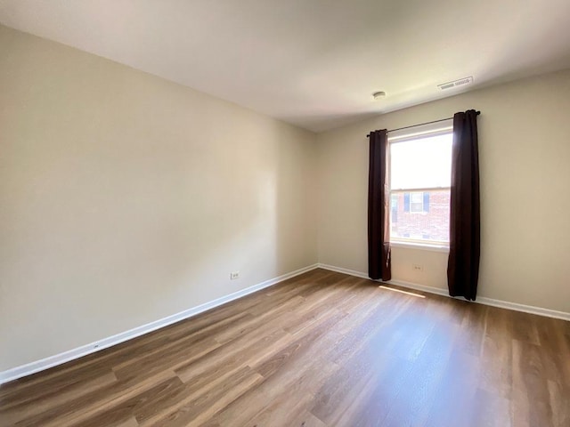 1340 Mcdowell Rd Unit 201, Naperville, IL 60563 - unfurnished room with wood finished floors and baseboards