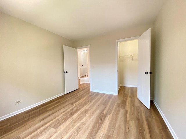 1340 Mcdowell Rd Unit 201, Naperville, IL 60563 - unfurnished bedroom with light wood-style flooring and a closet