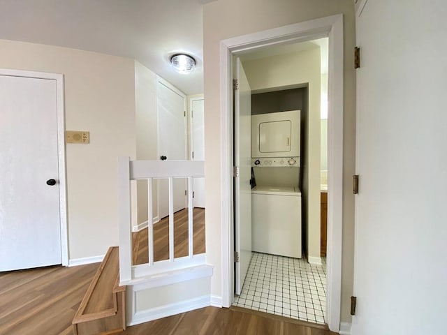 1340 Mcdowell Rd Unit 201, Naperville, IL 60563 - washroom featuring stacked washer and clothes dryer and wood finished floors
