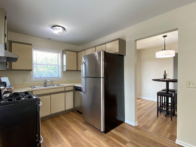 1340 Mcdowell Rd Unit 201, Naperville, IL 60563 - kitchen featuring stainless steel appliances, light wood-style floors, light countertops, and hanging light fixtures