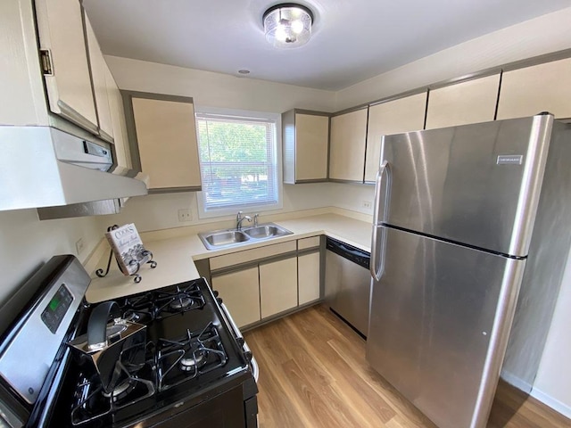 1340 Mcdowell Rd Unit 201, Naperville, IL 60563 - kitchen with stainless steel appliances, light wood finished floors, light countertops, and exhaust hood