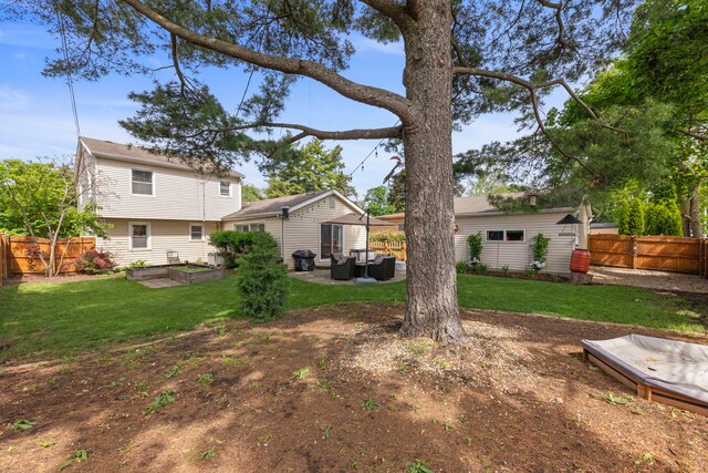 1341 S Sumner St, Wheaton, IL 60189 - fenced backyard with outdoor lounge area and a garden