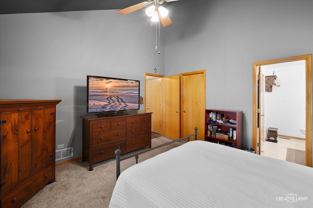 1306 Riverview Dr, Joliet, IL 60431 - bedroom with light carpet, a high ceiling, ceiling fan, and ensuite bath