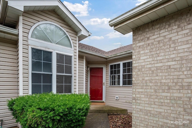 1306 Riverview Dr, Joliet, IL 60431 - property entrance with a shingled roof