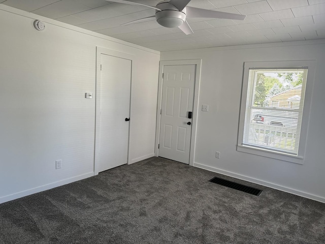 1453 S Oak Ave, Freeport, IL 61032 - entryway featuring dark carpet and ceiling fan