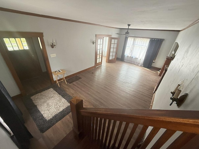 207 College Ave, Dixon, IL 61021 - foyer with wood finished floors, crown molding, healthy amount of natural light, and a ceiling fan