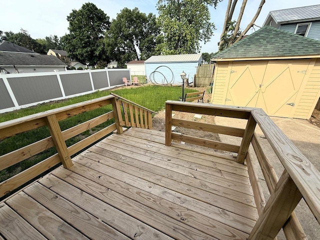 207 College Ave, Dixon, IL 61021 - wooden terrace featuring a shed and a fenced backyard