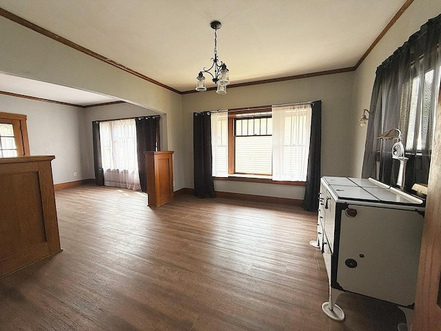 207 College Ave, Dixon, IL 61021 - dining room with wood finished floors, crown molding, and arched walkways