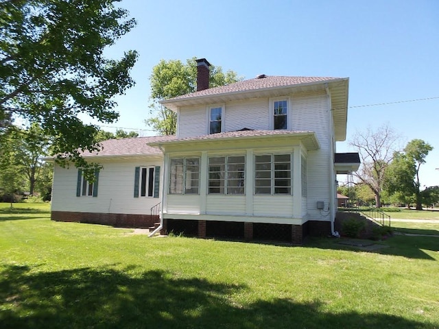 1201 Old Indian Town Rd, Henry, IL 61537 - rear view of property featuring a chimney and a lawn