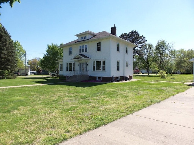 1201 Old Indian Town Rd, Henry, IL 61537 - view of front facade with a chimney and a front yard