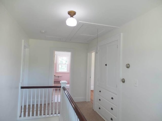 1201 Old Indian Town Rd, Henry, IL 61537 - hallway featuring radiator and attic access