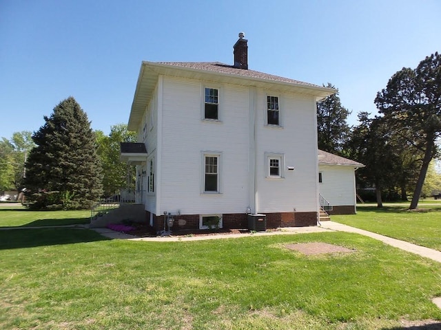 1201 Old Indian Town Rd, Henry, IL 61537 - view of side of property with a yard, a chimney, and entry steps