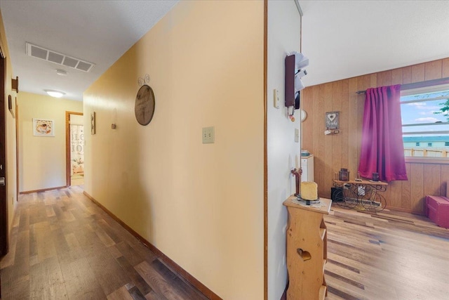 305 E Marshall St, Tolono, IL 61880 - hall with wood finished floors and wood walls