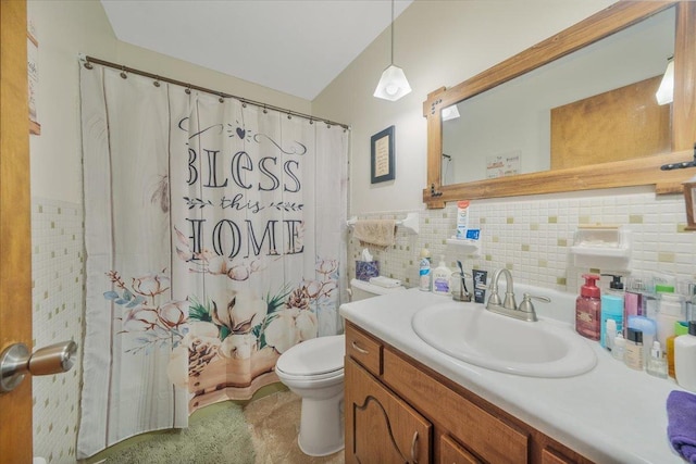 305 E Marshall St, Tolono, IL 61880 - full bath featuring tile walls, vanity, curtained shower, and wainscoting
