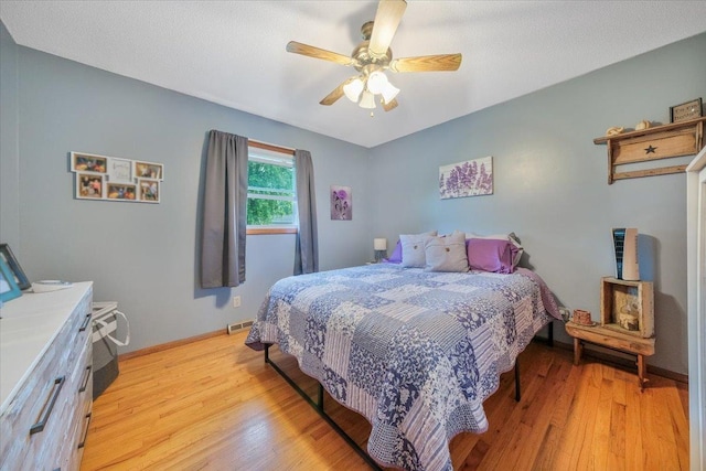 305 E Marshall St, Tolono, IL 61880 - bedroom with light wood-style floors and a ceiling fan